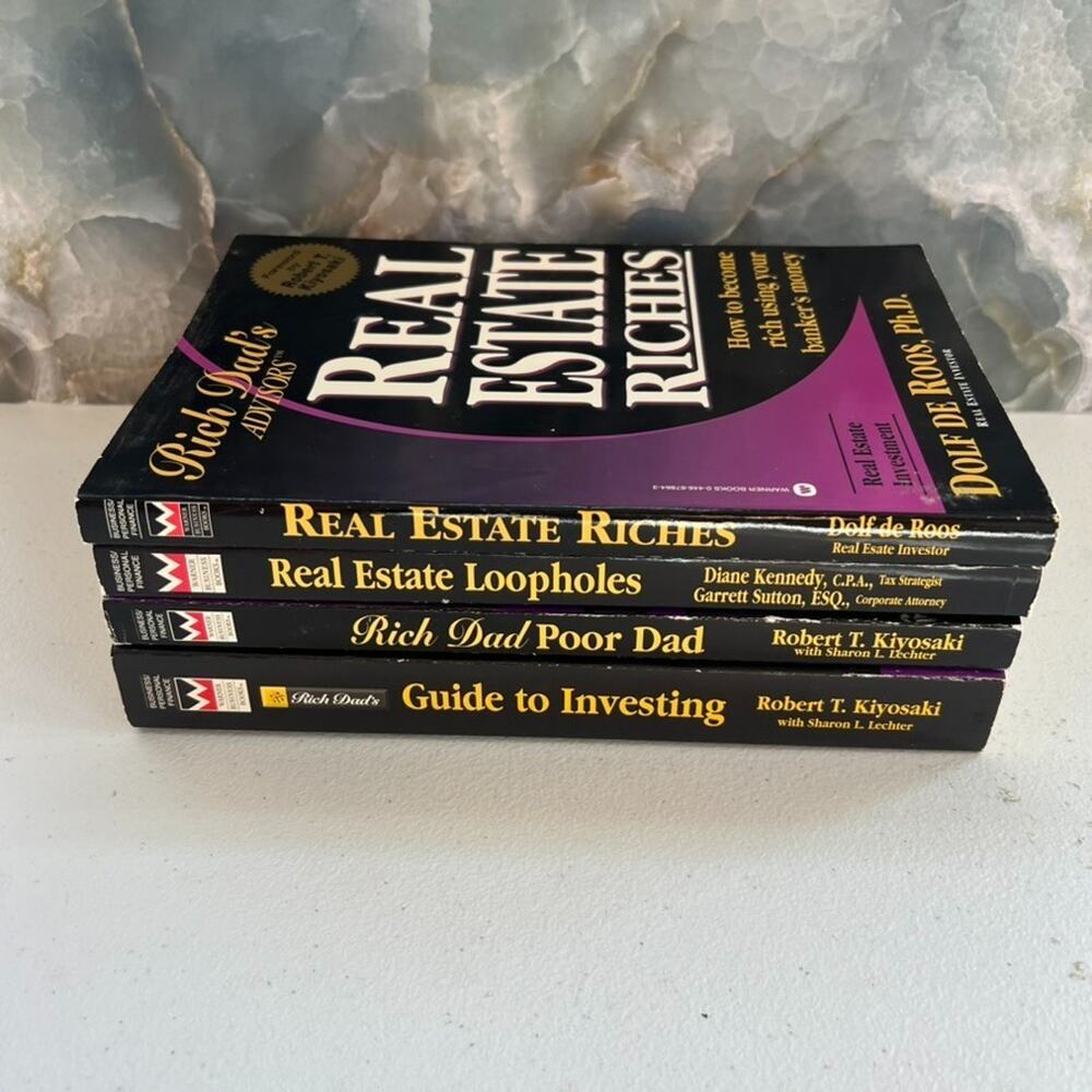 Lot of 4 Rich Dad Poor Dad Softcover books by Robert Kiyosaki & Dolf de Roos